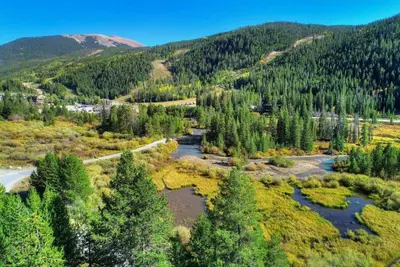 an aerial view of a river in a forest at Clearwater Lofts - New! Modern 2 Bedroom Near Keystone Lake in Keystone