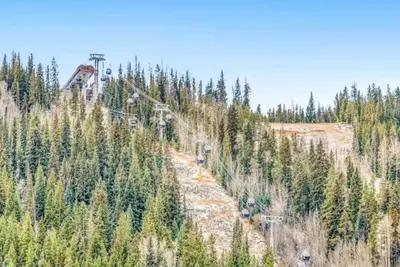 a hillside with trees and a ski lift at River Run Village 2 Bedroom At Red Hawk in Dillon