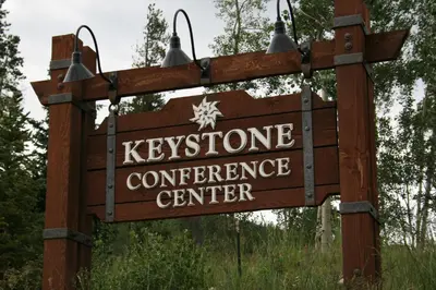 a sign for the kynesoperative conference center at Quicksilver 1677 by SummitCove Lodging in Keystone