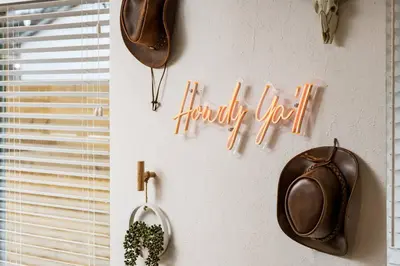 a sign that says happy new year hanging on a wall at Wild West Disco Haus 2! New Hot Tub, Patio + Gym in Denver