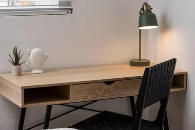 a wooden desk with a lamp and a chair at Wild West Disco Haus! New Hot Tub, Patio + Gym in Denver