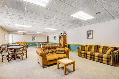 a living room with couches and a table and chairs at Iron Horse Resort D3084 in Winter Park