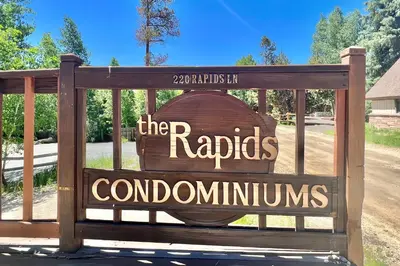 a sign for the rapidsordominesoundsounds at On the Rapids - A Unit in Grand Lake