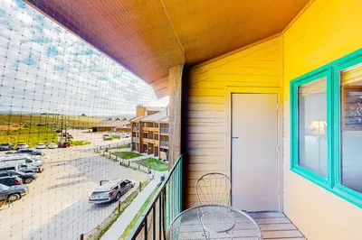 a balcony with a view of a parking lot at Silver Lodge A & B in Granby
