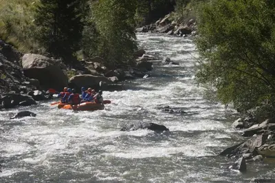 a group of people rafting down a river at Hay Meadow Lodge townhouse in Fraser