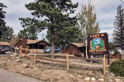 a sign for a restaurant with a building at Lazy R Cottages- 7B cottage in Estes Park