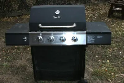 a black stove with a box on top of it at Triple R Cottages- 2 cabin in Estes Park
