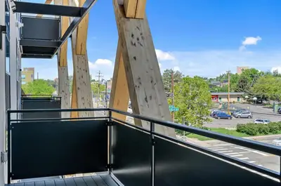 a balcony with a view of a parking lot at Canvas & Comfort | Espadin LoHi in Denver