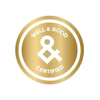 a gold button with a well and good certified symbol at Natural Influence | Espadin LoHi in Denver