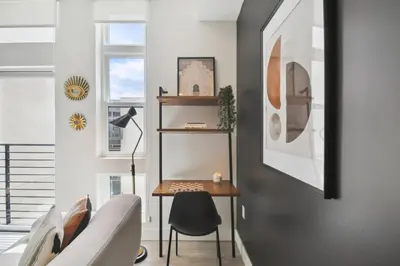 a living room with a table and a chair at Moroccan Mood | Espadin LoHi in Denver