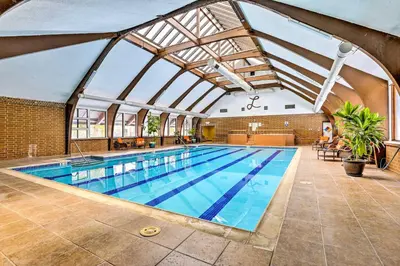 a large swimming pool with a glass ceiling at half Mi to Lake Dillon Mtn-View Condo in Frisco in Frisco