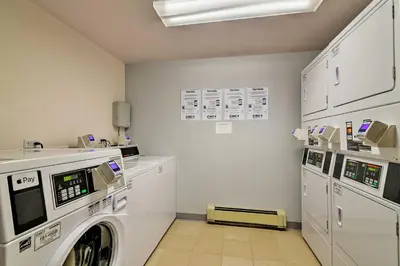 a laundry room with a washer and dryer at Colorado Condo about 2 Mi to Winter Park Resort! in Winter Park