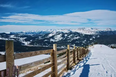 a wooden fence on top of a snow covered mountain at Frisco Mountainside Retreat: Walk Downtown in Frisco