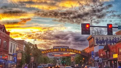 a street with a traffic light and a welcome to golden sign at Unbeatable Location Golden Condo - Walk Everywhere in Golden