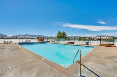 a swimming pool with a view of the water at Fraser Condo with Ski Shuttle and Resort Amenities! in Fraser