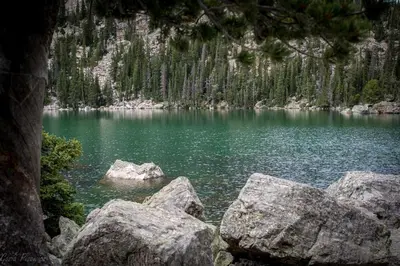 a view of a lake with rocks in the water at Chasm Cabin -- 20-NCD0048 cabin in Estes Park