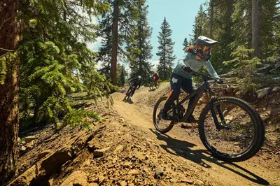 a group of people riding bikes on a dirt trail at Beautiful 2BR in River Run - Kids Ski Free! condo in Dillon