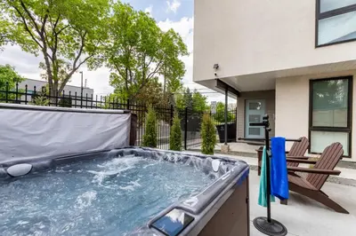 a hot tub on the patio of a house at LuxuryDenver Studio w Hot Tub 2 Mi to Downtown in Denver