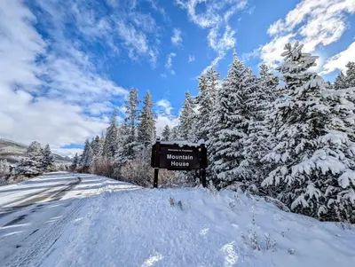 a sign on the side of a snow covered road at Hidden River Lodge 5969 by SummitCove Lodging in Keystone
