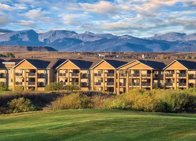 a view of a resort with mountains in the background at Worldmark Granby Rocky Mountain 2BD in Granby