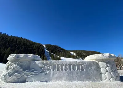 an ice sculpture of a sign in the snow at Gateway Lodge 5037 by SummitCove Lodging in Keystone