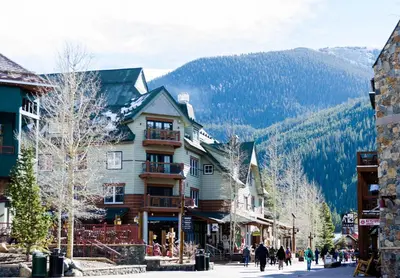 a building on a street with a mountain in the background at Ski Tip 8709 : 2 in Keystone