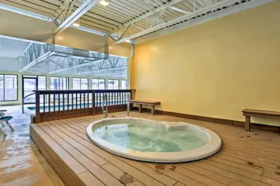 a hot tub in the middle of a room at Ski Retreat with Hot Tub Access in Winter Park! in Winter Park