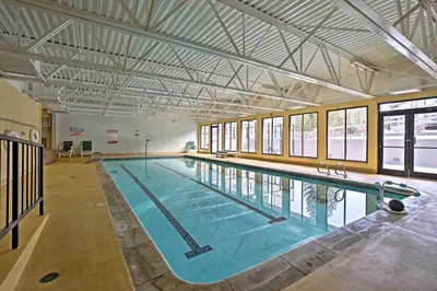 a large swimming pool in a large building at Ski Retreat with Hot Tub Access in Winter Park! in Winter Park