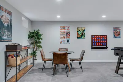 a dining room with a table and chairs at Mid Summer Night's Dream w Hot Tub Theater Game Room in Arvada