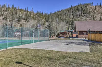 a basketball court with a fence and a basketball hoop at 4 Mi to Ski Resort Pet-Friendly Breck Cabin in Breckenridge