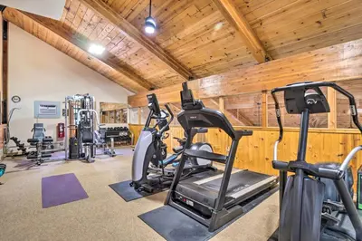 a gym with several treadmills and exercise bikes at 4 Mi to Ski Resort Pet-Friendly Breck Cabin in Breckenridge