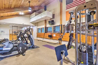 a gym with two treadmills and two ellipticals at 4 Mi to Ski Resort Pet-Friendly Breck Cabin in Breckenridge