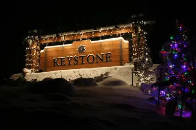 a christmas tree and a sign that says kynes at Ski Run 303 by SummitCove Lodging in Keystone