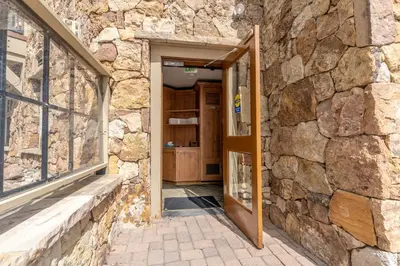 an open door into a stone building with a stone wall at Lone Eagle 3012 in Keystone