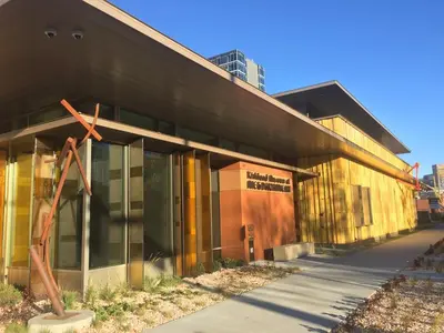 a building with a cross on the side of it at 1 bed apartment with parking - Denver Museum District Walk to Convention Center, Capital, museums and shops in Denver