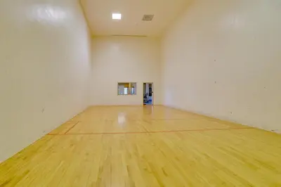 an empty gym with a wooden floor in a room at 2 Mi to Granby Ranch Mtn-View Studio with Perks in Granby