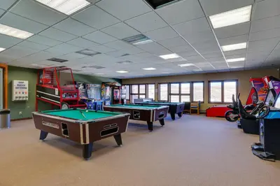 a gaming room with pool tables and fire trucks at 2 Mi to Granby Ranch Mtn-View Studio with Perks in Granby