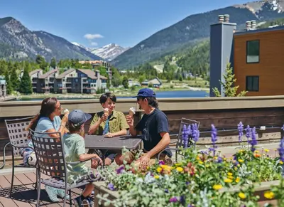 a group of people sitting at a table eating ice cream at Beautiful Renovated 3BR in Keystone condo in Keystone