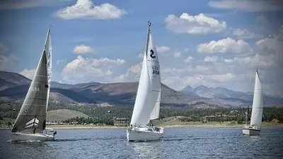 three sailboats in the water on a lake at Aspen Meadows C-302, 0013 in Granby