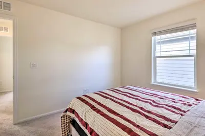 a bedroom with a bed and a window at Charming 3BR Retreat - Perfect for Families! in Fort Collins