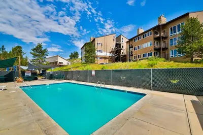 an image of a swimming pool at a apartment complex at Mountainside 001 in Granby