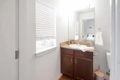 a bathroom with a sink and a mirror at Welcoming Hideaway Near UNC & Downtown in Greeley