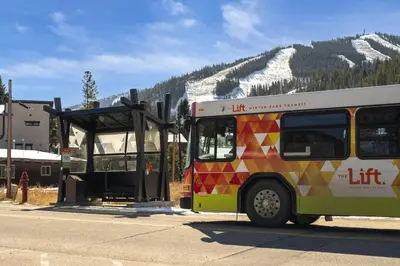 a bus parked at a bus stop in the mountains at Winter Park Chalet I Mtn Biking I Summer festivals in Winter Park