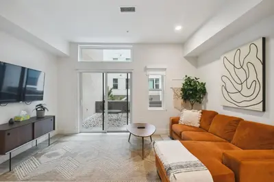 a living room with a couch and a tv at 2880 Natural Influence Sanctuary at Espadin in Denver