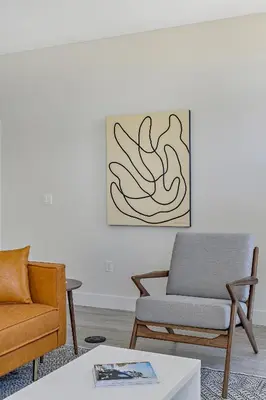 a living room with two chairs and a couch at 2880 Modern Lifestyle Loft at Espadin in Denver