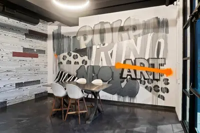 a dining room with a table and chairs at 3198 Bohemian Hideaway at RiNo Art Lofts in Denver
