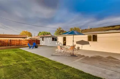 a patio with a table and an umbrella at Private Chic 2 Bathroom 10 min to Downtown With Fast Wifi in Denver