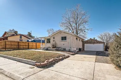 a house with a fence and a driveway at Sleeps 10 And Pet Friendly Home In Denver Near Red Rocks in Denver