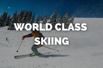 a person on skis in the snow with words world class skiing at Central Denver Townhome Close To Historic Neighborhood in Denver