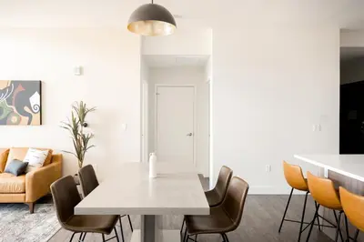 a dining room with a table and chairs at 2880 U505 Skytop Perspective at Espadin in Denver